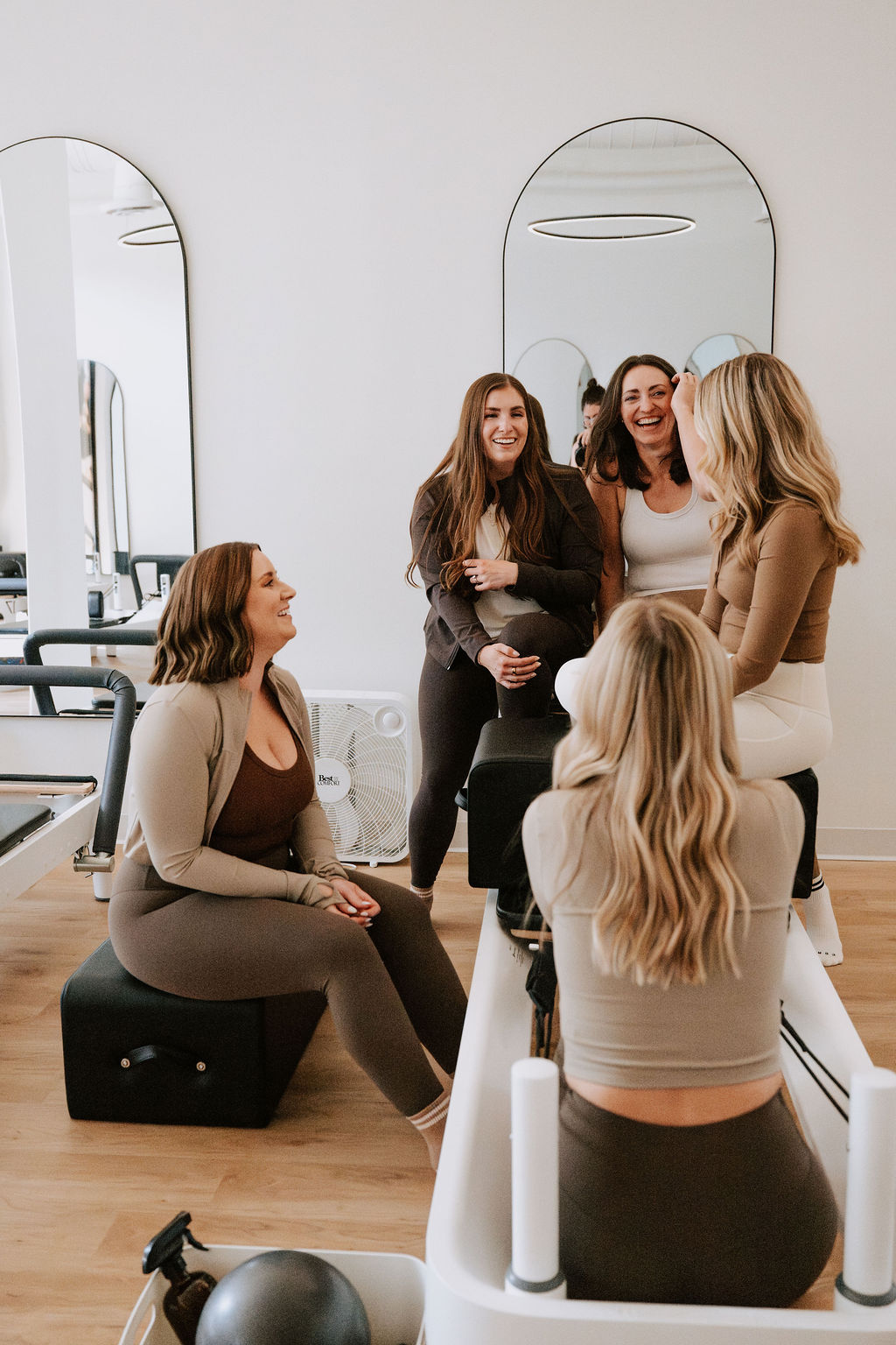 Core Collective members sitting and chatting after class
